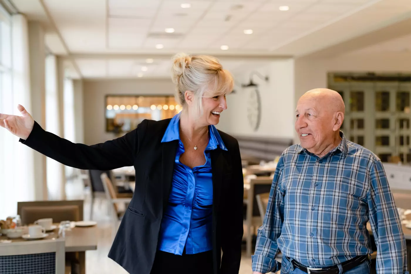 Chartwell Staff showing around the residence to a senior